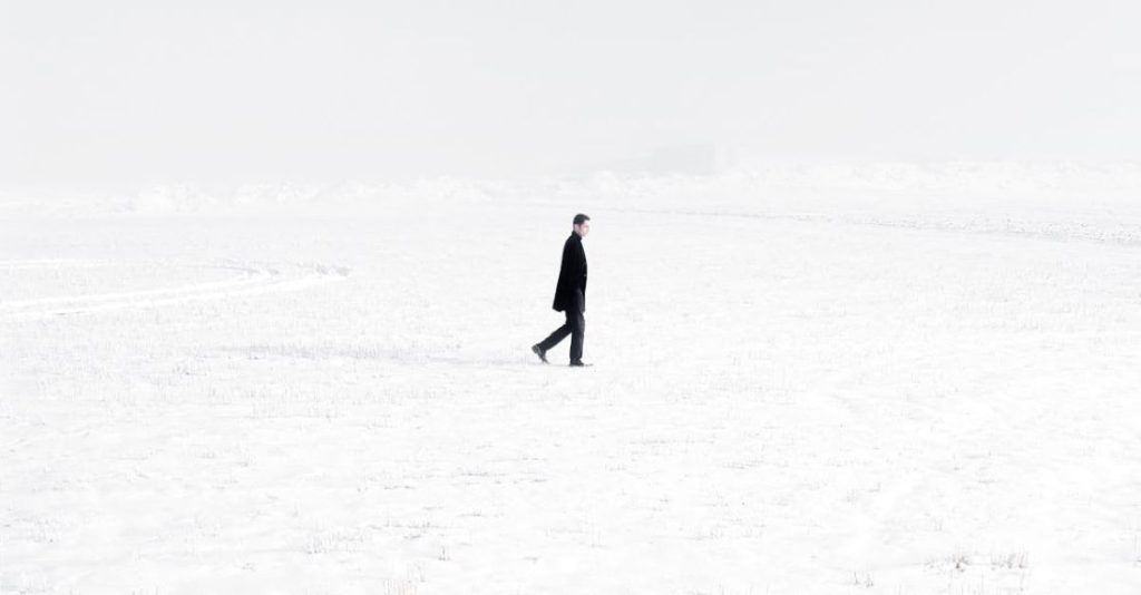 Ground Covers - Lonely man in middle of snowy valley