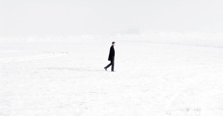 Ground Covers - Lonely man in middle of snowy valley