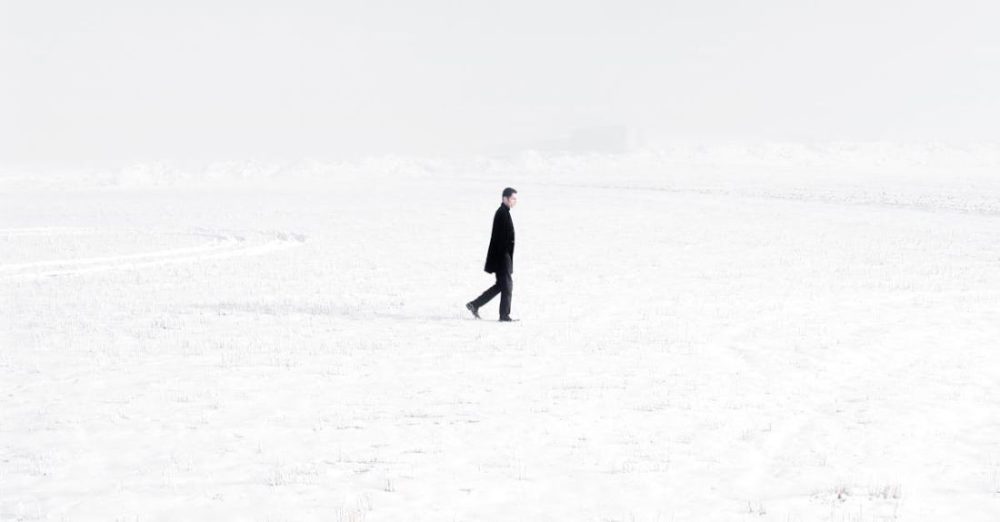 Ground Covers - Lonely man in middle of snowy valley