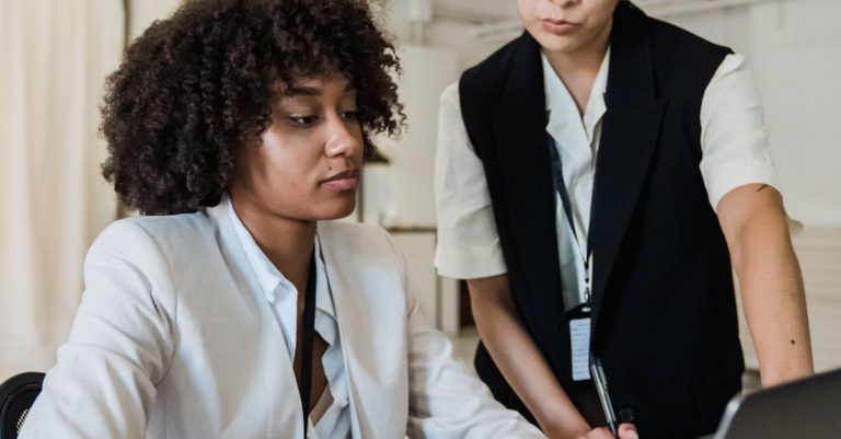 Focal Points - Senior Specialist Pointing Crucial Points to Young Worker