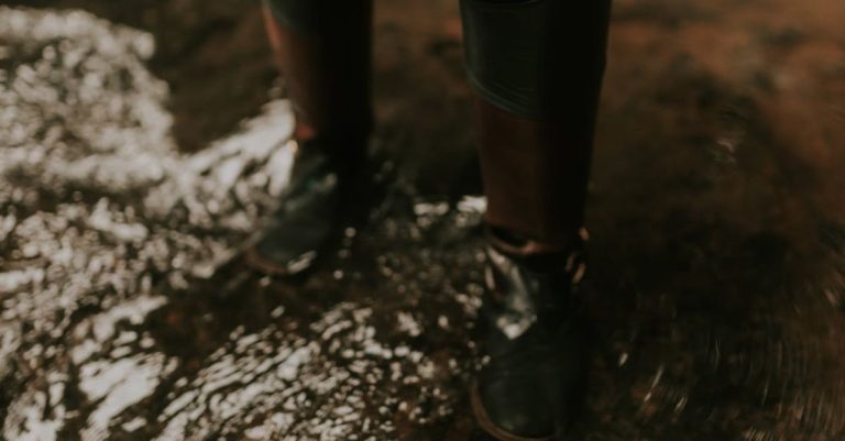 Over-Fertilizing - A person in boots standing in water
