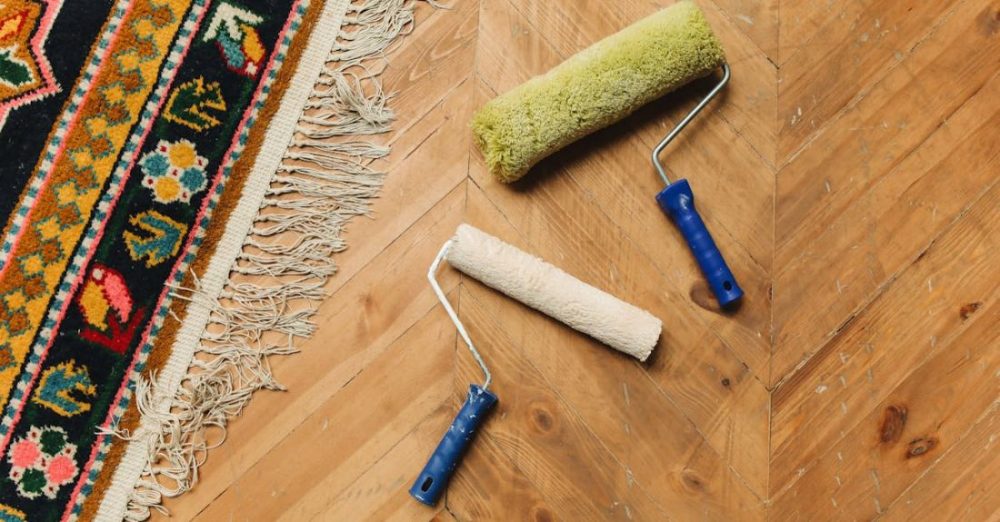 Tools - Paint Rollers Lying on a Wooden FloorÂ
