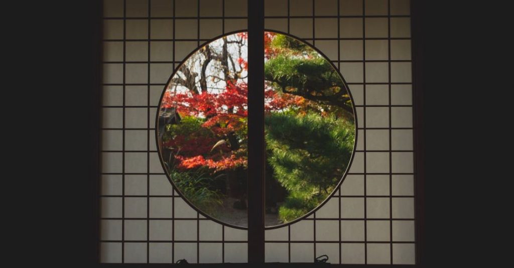 Year-Round Garden - Window in Japanese style with view of trees in autumn