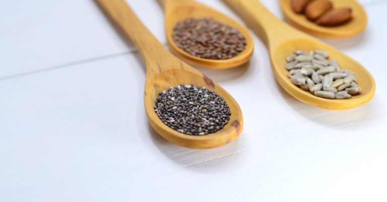 Seeds - Closeup Photo of Four Brown Wooden Spatulas With Seds